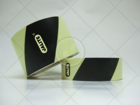 Self adhesive photoluminescent vinyl warning tape